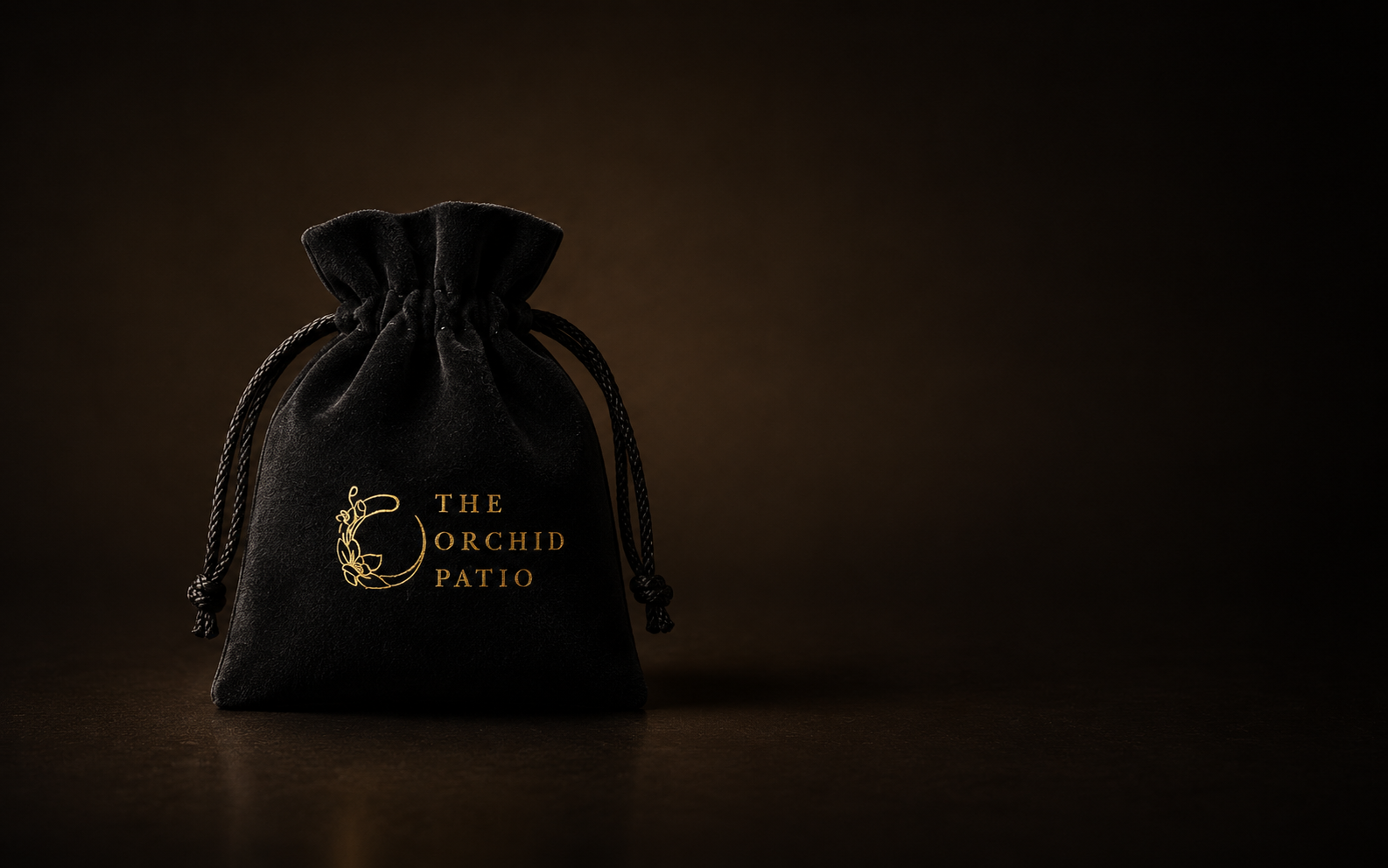 Black velvet jewellery pouch for storing The Orchid Patio jewellery